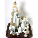 A collection of ten assorted Lladro figures including a large figure of a girl, various animals