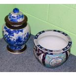 A Japanese porcelain cache pot and a Chinese blue and white covered jar