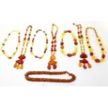 Eight various amber bead necklaces