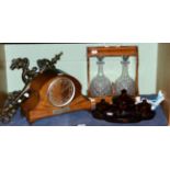 A 1930's mantel timepiece, a two bottle tantalus, 1930's dressing table glass and a pair of three