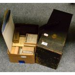 An Ensign Comet No.5 magic lantern together with over one hundred assorted 2inch square glass slides