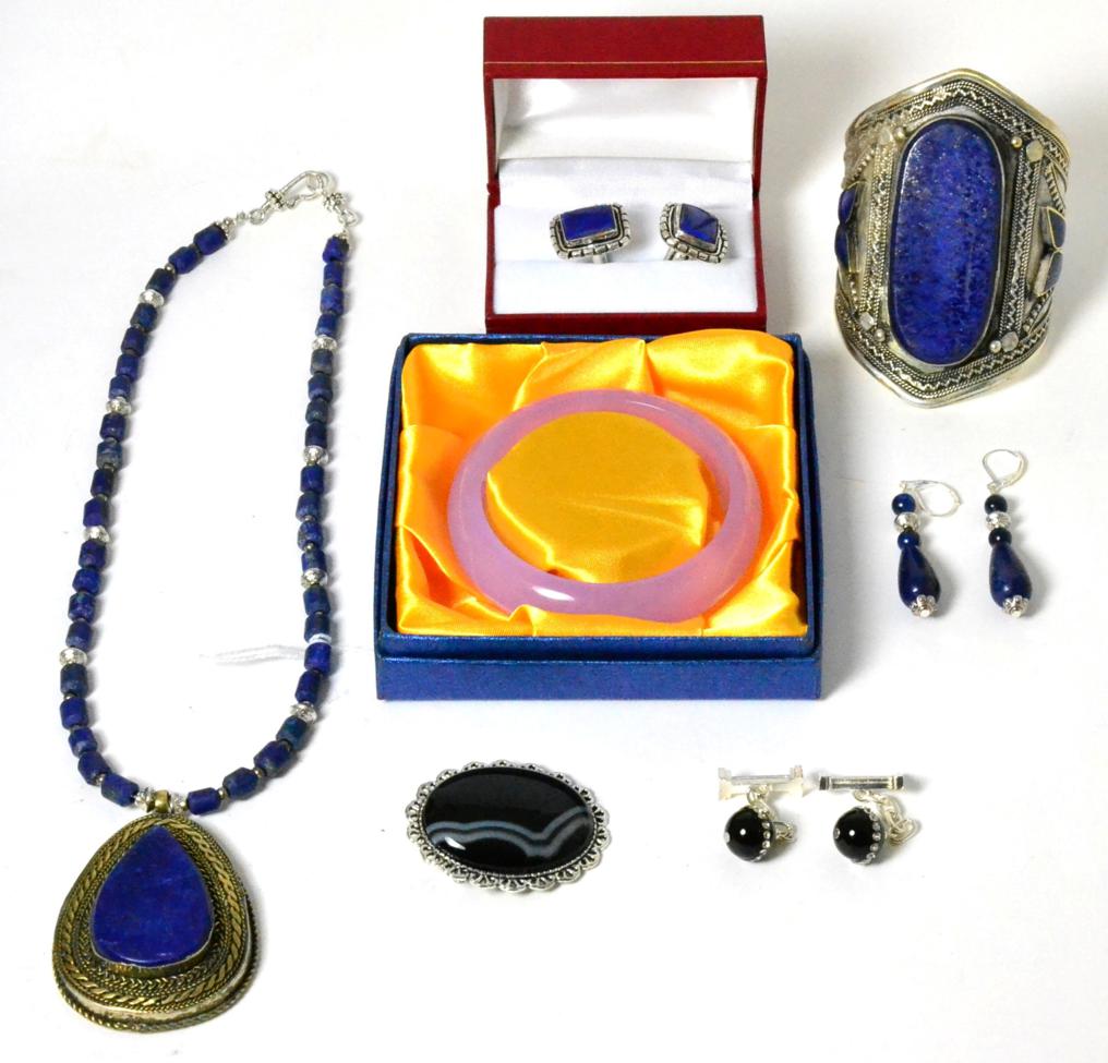 A lapis lazuli necklace, a lapis lazuli cuff bangle, a pair of lapis lazuli earrings, a pair of