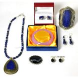 A lapis lazuli necklace, a lapis lazuli cuff bangle, a pair of lapis lazuli earrings, a pair of