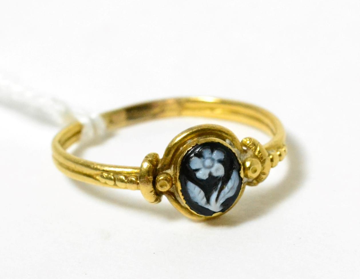 A mourning ring, finger size L, shank misshapen 2.35g gross