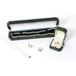 A 9ct gold diamond set heart shaped pendant and earring set, a 9ct gold cultured pearl ring, a 9ct