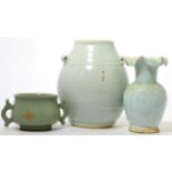 An early Chinese qingbai glaze jar with lug handles, a moulded qingbai vase with foliated rim, and a