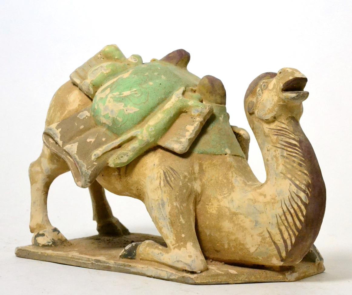 A Chinese terracotta model of a seated camel, 19th century