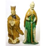 A Chinese pottery statue of a Daoist sage, 19th century, and a Chinese sancai pottery figure of a