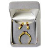 A ruby and diamond ring and earring set Finger size Q, 7.8g gross