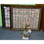 A set of Wills cigarette cards, a set of players cigarette cards both framed and a vaseline pivoting