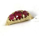 A Victorian three stone ruby ring Finger size G1/2, 5.58g gross