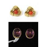 A pair of amethyst ear stud earrings, stamped '750' and a pair of coral stud earrings, stamped '