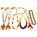 Eight various amber bead necklaces