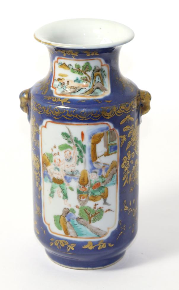 A Chinese blue ground vase with gilt decoration and reserves painted with fighting figures Some