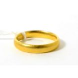 A gold band ringFinger size R, 5.98g gross.