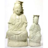 A Chinese blanc-de-chine figure of Guanyin and a smaller similar figure, both 19th century