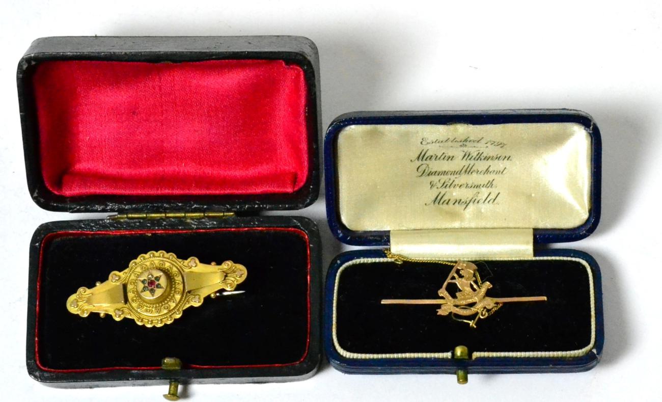 A Victorian 9ct gold brooch in the Renaissance revival style and a West Riding Regiment pierced gold