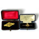 A Victorian 9ct gold brooch in the Renaissance revival style and a West Riding Regiment pierced gold