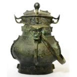 A bronze huang vessel and cover