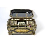 A 19th century lacquered sewing box with ivory fitments Rubbing to the gilding on the box cover,