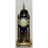 A brass and porcelain clock (a.f)