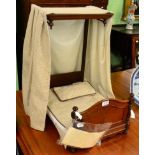 A Victorian mahogany dolls half tester bed, with turned bed ends, replacement curtain, bed cover and