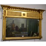 A Regency inverted breakfront gilt over mantel mirror