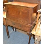 A mahogany drinks cabinet with hinged top and fall front on cabriole supports