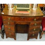 A George III mahogany bow fronted kneehole desk