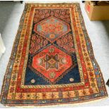 A Hamadan Rug, Iranian Kurdistan, the indigo field with two serrated lozenges enclosed by narrow