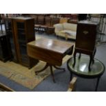 A 20th century oak glazed bookcase; an oval topped side table and a mahogany Pembroke table on