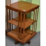 An early 20th century oak revolving bookcase