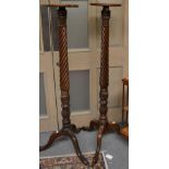 A pair of 19th century mahogany Wrythen-form torchere stands, on tripod bases, 51cm high (2)