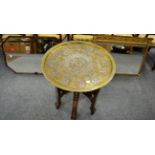 Moorish brass and inlaid circular tray top table on folding stand and two framed mirrors (4)