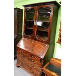 A George II mahogany bureau bookcase, 3rd quarter 18th century with a dentil cornice above glazed