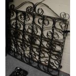 A pair of black painted mild steel gates