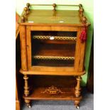 A 19th century satinwood inlaid walnut music cabinet moving on castors