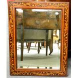 An Edwardian marquetry inlaid rectangular wall mirror