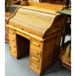 An early 20th century oak roll top desk (locked - no key)