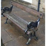 A Victorian cast iron ended, slatted wooden garden bench