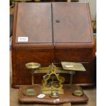 A late Victorian burr walnut stationery casket, together with a pair of postal scales