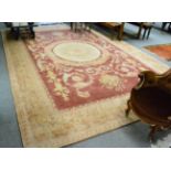 Savonerie design carpet, China, the field of scrolling acanthus centred by a roundel panel framed by