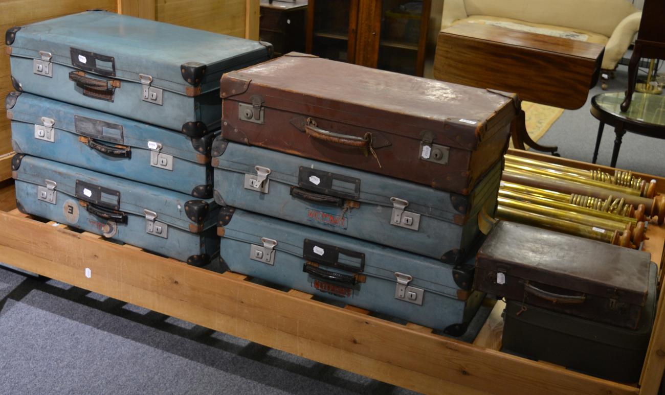 A group of eight vintage suitcases