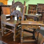 A carved oak stool together with a similar chair and an oak magazine rack