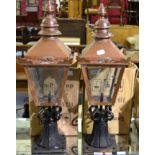 A pair of copper lamps