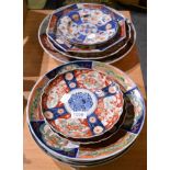 A pair of 18th century Chinese porcelain plates, together with a nine other Japanese Imari