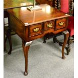 A reproduction Georgian style three drawer lowboy