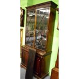 A mahogany astragal glazed bookcase decorated with blind fret work