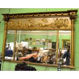 A Recency gilt gesso sectional inverted break front over mantel mirror