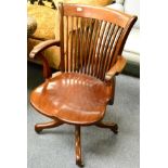A late 19th/early 20th century swivel office chair